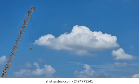 white clouds, blue sky, and something