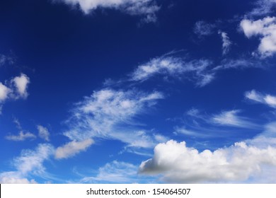 White clouds in a dark blue sky