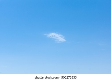 white clouds floating on a background of blue sky