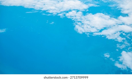 White clouds floating over rural farmland