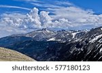 White clouds over mountain peaks. Rocky Mountains National Park. Denver. Colorado. United States.