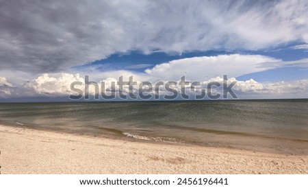 White clouds over the ocean, windless weather, doldrums