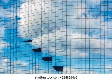 White Clouds Reflection On Glass Wall Building