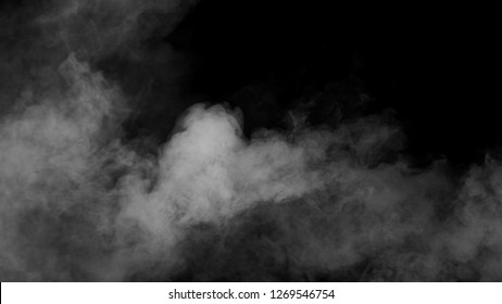 White clouds of vapor smoke are isolated on a black background. Gas explodes, swirl and dances in space. A magic fog dust texture effect that can be used by overlay and changing their transparency. - Shutterstock ID 1269546754