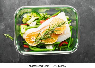 White Cod Fish Fillet Box. Fresh Vegetables With A Slice Of Cod In A Glass Container. Top View