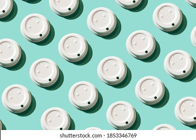 White Coffee Cup Lid Pattern On The Turquoise Background. Recycle Reusable Things Concept. Plastic-free Concept. Zero Waste. Top View. Image For Covers, Wallpapers