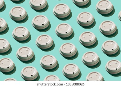 White Coffee Cup Lid Pattern On The Turquoise Background. Recycle Reusable Things Concept. Plastic-free Concept. Zero Waste. Top View. Image For Covers, Wallpapers