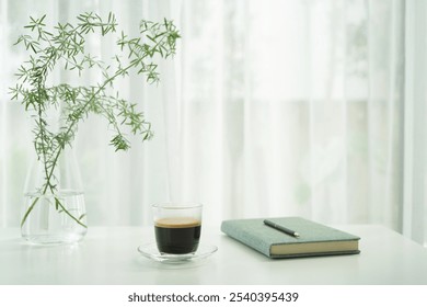 white coffee cup and plant pot on white table minimal interior - Powered by Shutterstock