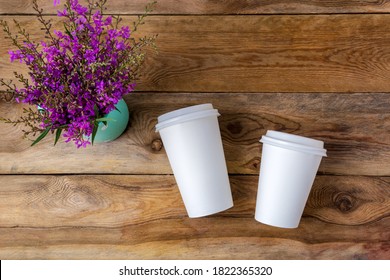 White Coffee Disposable Hot Paper Cup With Lid Mockup With Purple Wildflowers. Plastic Coffee Cups With Lids Mock Up For Design Promotion.  