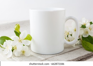 White Coffee Mug Mockup With Blossoming Apple Tree Branch.  Empty Mug Mock Up For Design Promotion.  