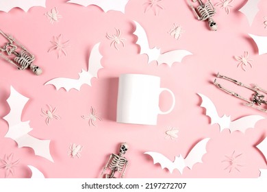 White Coffee Mug Mockup For Design, Quote, Brand Or Logo With Halloween Paper Decorations. White Ceramic Mug On Pink Background.