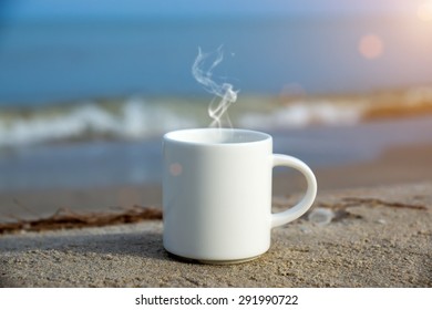 White Coffee Mug On The Beach.