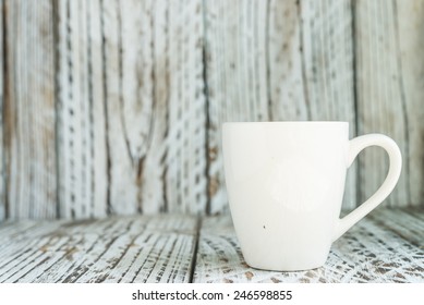 White Coffee Mug On Wood Background