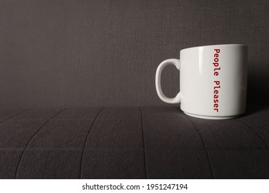 White Coffee Mug With Text Printed PEOPLE PLEASER, A Person Who Have Troube Saying No, Seeking Validation, Tries Hard To Make Others Happy