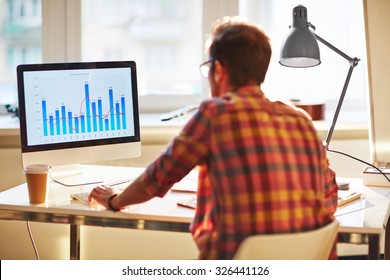 White collar worker analyzing financial chart in office