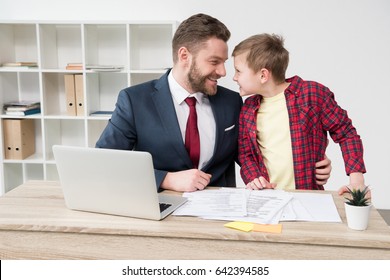 White Collar Worker With Son At Office