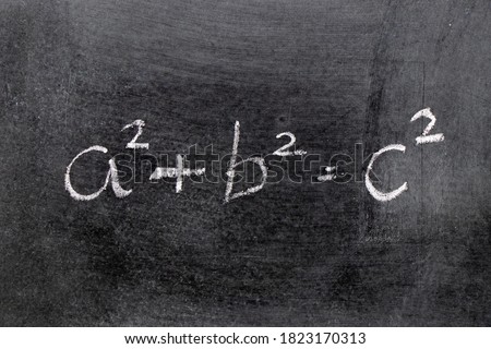 White color chalk hand writing in mathematics formula (Pythagorean theorem or Pythagoras's theorem) on blackboard background