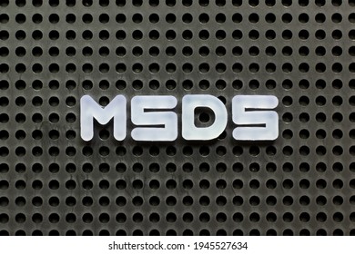 White Color Letter In Word MSDS (Abbreviation Of Material Safety Data Sheet) On Black Pegboard Background