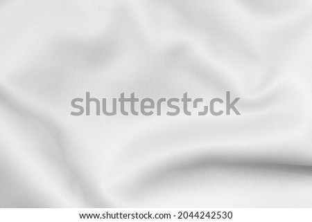 White color sports clothing fabric football shirt jersey texture and textile background.