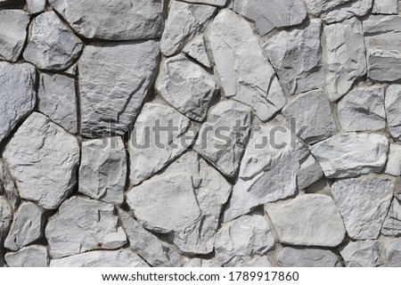 
White color of stone brick wall texture abstract background.  Grey Brickwork or stonework wall.
