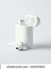 white colour airpods with white background