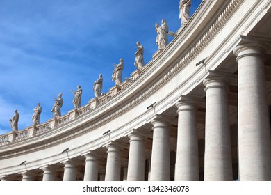 White Columns And Statues Above The Colonnade Of The Architect Bellini In The Saint Peter Square In The Vatican City In Central Italy