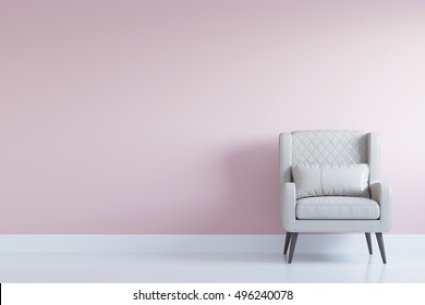 White comfortable arm chair in interior living room with pastel pink wall for copy space. Minimal interior.