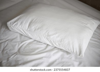 White comfy pillow in hotel room