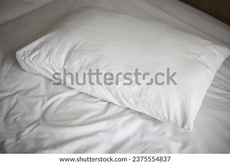 White comfy pillow in hotel room