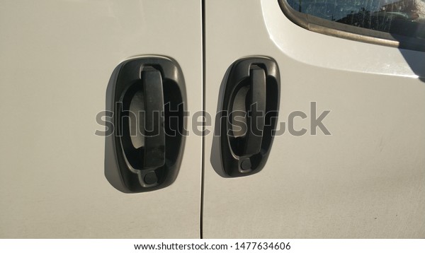 white commercial car\
, black door handles
