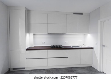 White compact kitchen with a beautiful interior - Shutterstock ID 2207082777