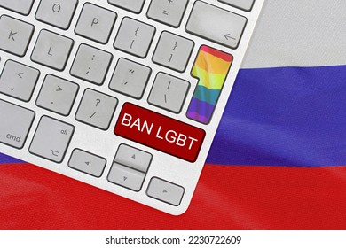 White computer keyboard with button of flag LGBT and red button with Text of Ban LGBT on Russia flag background. Prohibition of LGBT propaganda in Russia. Ban on LGBT people in Russia - Shutterstock ID 2230722609