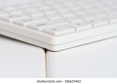 White computer mouse on the keyboard