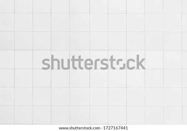 white concrete tile wall modern floors and textures\
Square Ceramic Mosaic Cube Pattern for Home Ideas Business And for\
decorating the bedroom. White rectangle mosaic tiles texture\
background. 