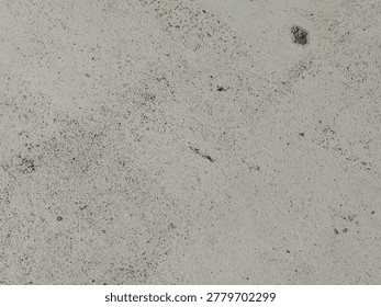 White concrete wall texture with subtle dirt marks and rough surface for minimalist abstract background design. 