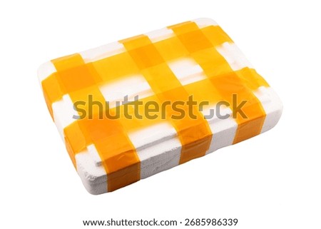 White container or box made of expanded polystyrene foam for packaging and transporting fragile and breakable goods, secured with yellow packing tape, close-up on white background, postal concept
