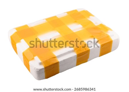 White container or box made of expanded polystyrene foam for packaging and transporting fragile and breakable goods, secured with yellow packing tape, close-up on white background, postal concept