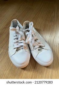 White Converse, Unlabelled Shoes For Girls. On Plain Floor