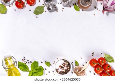 White cooking background with useful cooking italian Mediterranean ingredients - tomatoes, basil leaves, greens, olive oil, salt, pepper, garlic, flat lay white table top view copy space  - Powered by Shutterstock