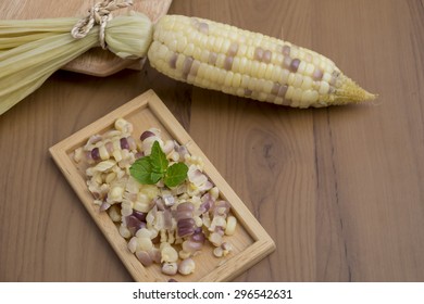 White corn on old wooden table - Shutterstock ID 296542631