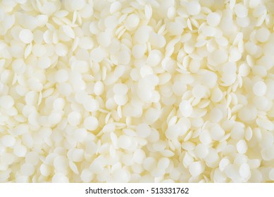 White Cosmetic Beeswax Pellets Background.

