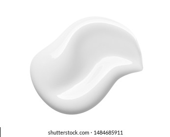 White cosmetic cream lotion swipe isolated on white background. Makeup foundation swatch smear smudge. BB, CC cream texture