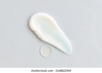 White Cosmetic Cream Texture, Skincare Lotion Swatch On Gray Background. Face Creme, Body Moisturiser, Hair Conditioner Smear Smudge Stroke. Creamy Beauty Product Closeup