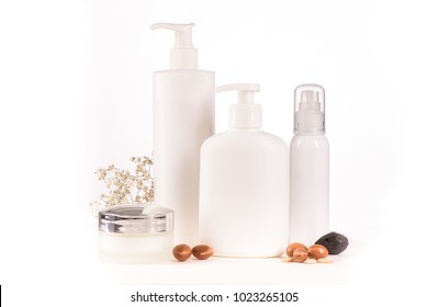 White Cosmetic Products With Argan Fruits For Skin Care And Hair On A White Background. Space For Labels And Graphics