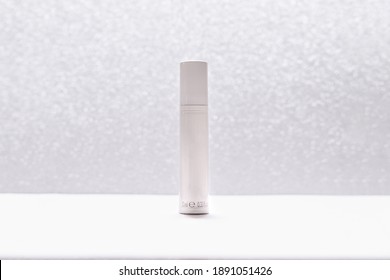 White Cosmetic Tube On Silver Glitter Background. Beauty Ad Concept, Blog, Geometrical Minimalism Product Photography, Mockup, Copyspace