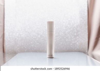 White Cosmetic Tube On Silver Glitter Background. Beauty Ad Concept, Blog, Geometrical Minimalism Product Photography, Mockup, Copyspace