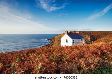 A white cottage on the cliffs at Cape Cornwall near St Just on the Cornish coastline