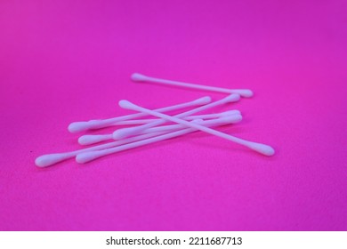 White Cotton Buds Isolated On Pink Background