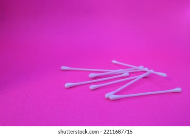 White Cotton Buds Isolated On Pink Background