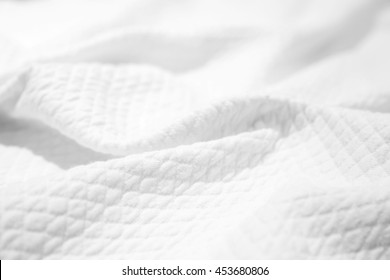 White Cotton Fabric Texture, Crumpled Blanket, Background Photo With Selective Focus